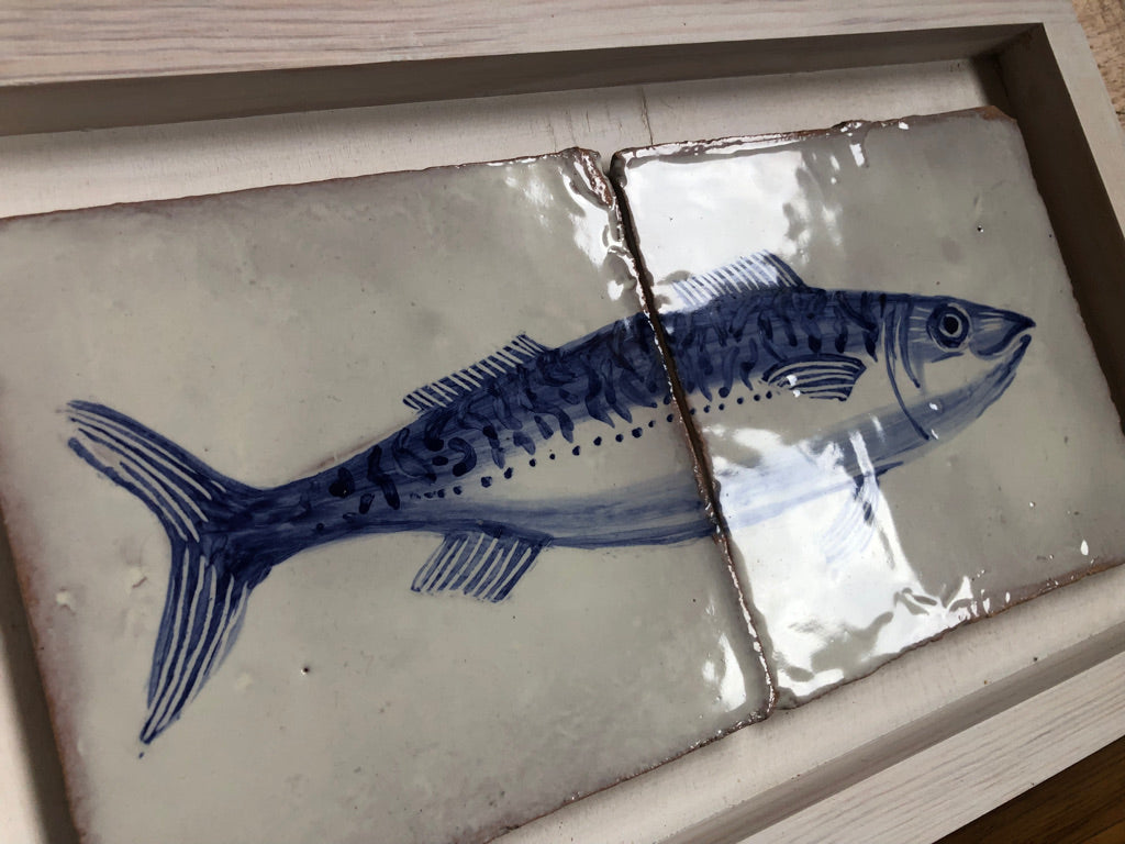 Two ceramic tiles with blue fish design on a white background. Azulejo portuguese with fish. Kézműves fali csempe.